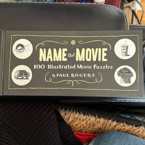 𝅺HARDCOVER Name That Movie: 100 Illustrated Movie Puzzles by Paul Rogers